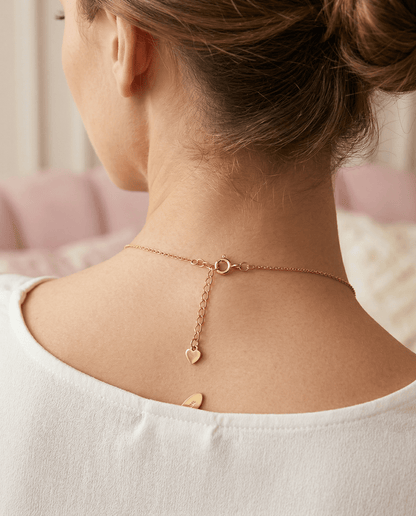 Frosted Feminine Love & Luck Charm Necklace dainty chain and chain extender clasped around female neck for comfortable wear.